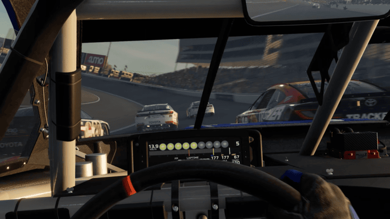 NASCAR 26 cockpit view at a road course showing Toyota Cup Series cars ahead with Kumo tire branding visible on the track surroundings